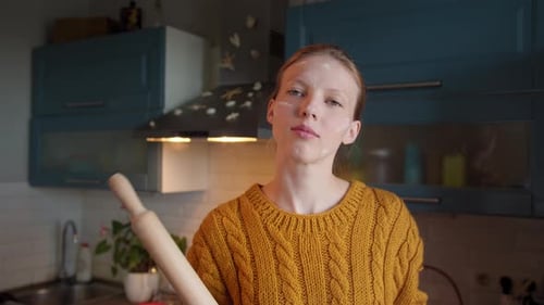 Portrait Young Woman Cooking on Kitchen Proud Looks at Camera Holds Rolling Pin in Hands