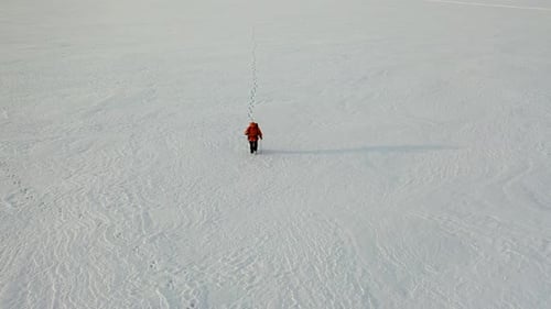 Search Rescue Operation in Tundra a View From a Helicopter on a Lone Traveler in the Middle of a