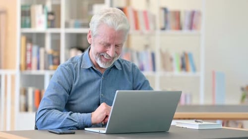 Mature Man Using Laptop on Video Call