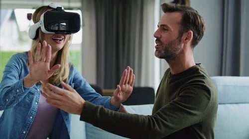 Woman Enjoys Virtual Reality Headset with Partner