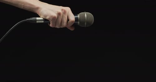 Hand dropping a microphone