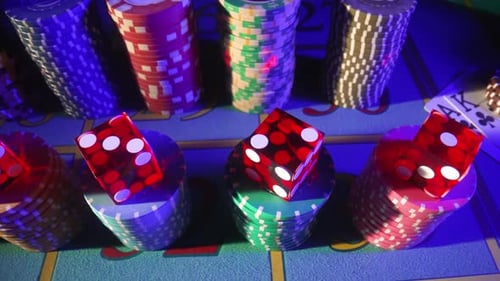 Close-up of Casino Chips and Dice on Table