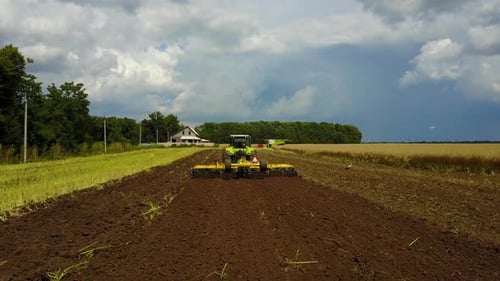 Tractor Plows the Field