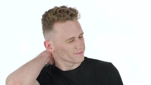 Young Adult Man Rubbing His Neck Close Up