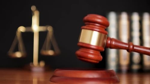 Judge Banging Gavel on Block Close Up