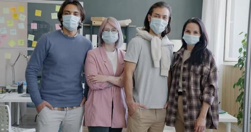 Group of People Colleagues Wearing Masks Standing in Office During Covid19 Pandemic