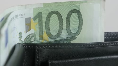 Paper money in black leather wallet 3840X2160 UltraHD tilting footage - Green 100 euro banknotes in