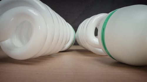 Energysaving Light Bulbs on Cardboard Surface in Studio