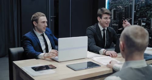 Young Adults Talking at a Corporate Meeting