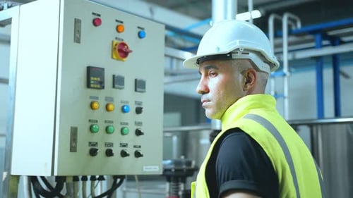 caucasian male senior engineering wearing safety uniform hand use checklists chart file folder