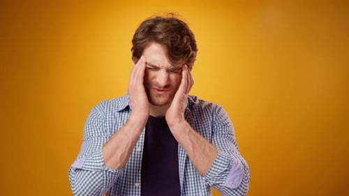 Man Feeling Headache Pain, Touching Forehead