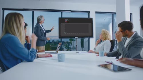 Adults Attending a Meeting With Presentation