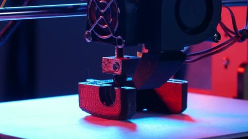 Concept of Modern Production Technologies. 3D Printer Printing Figure Close-up