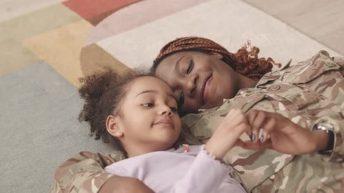 Loving Military Mom and Child Lying Together