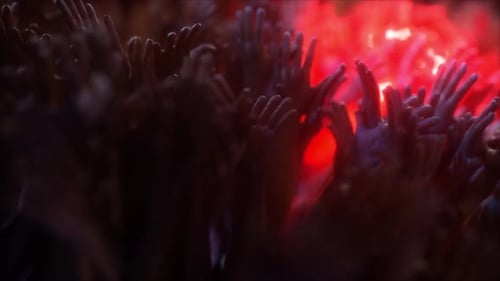 Concert Crowd Raising Hands with Dynamic Light Effects