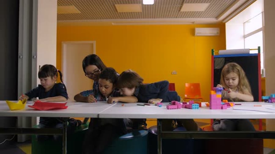 Cover for Diverse Kindergarten Pupils Learning at Classroom