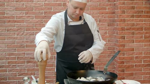 Chef Cooking Meal in Pan Outdoors