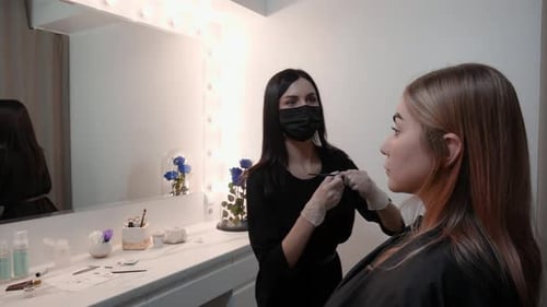 Cosmetologist Preparing for Beauty Treatment Indoors