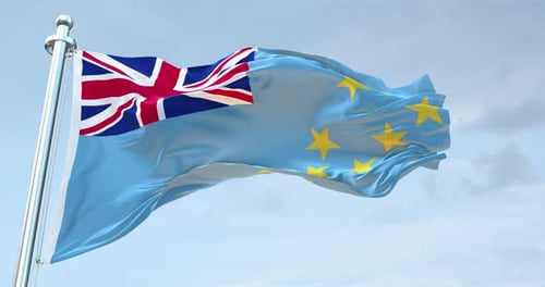 Tuvalu Flag Waving on Flagpole Against Blue Sky