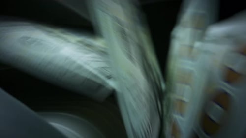 Money Counter Processes Stacks of United States Currency