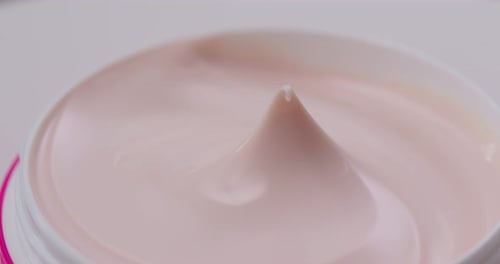 Pink Cosmetic Cream Close-up in a Jar