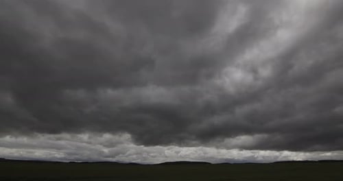 Storm Clouds In A Green Timelapse Field