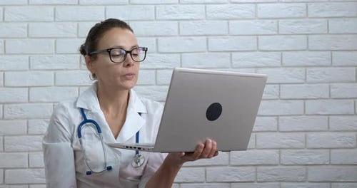 Woman Doctor with Webcam