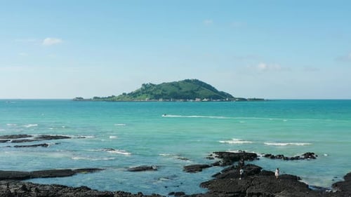 A view of the clear blue sea and the island. Jeju Island.