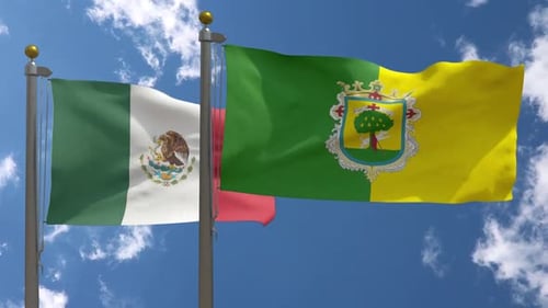 Waving Flags Of Mexico And Jalisco Against Blue Sky