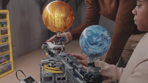 Working On Science Project With Teacher