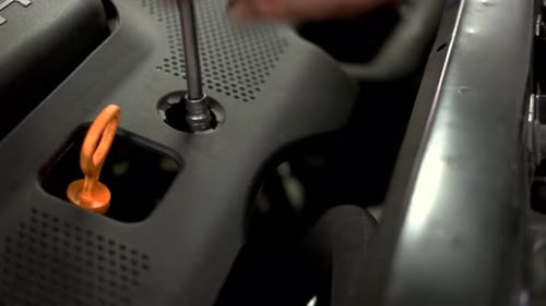 Close Up Unscrewing Car Engine