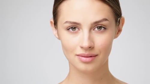 Young Woman Opens and Closes Eyes