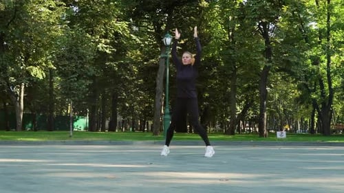 Fit Woman in Sportswear Doing Exercises in Park
