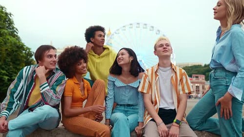 Group of Diverse Young Adults Talking Outdoors in City