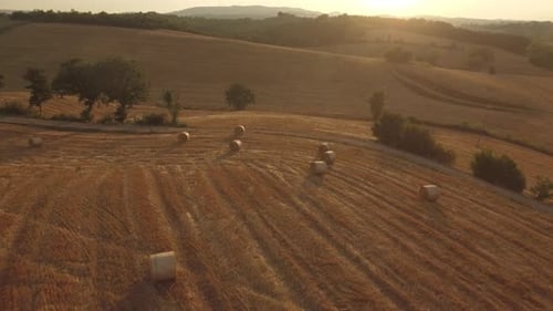 Sunset Behind Mountain Range and Tuscany Fields Italy