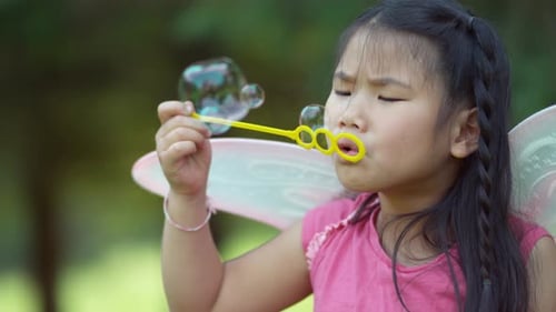 Girl in fairy princess costume blowing bubbles, shot on Phantom Flex 4K