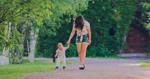 Happy Baby Goes with Mom for the Handle on the Track