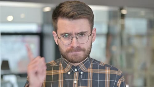 Portrait of Angry Young Designer in Office