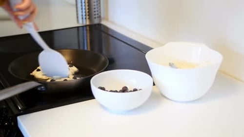 Mid-section of man mixing dough in bowl