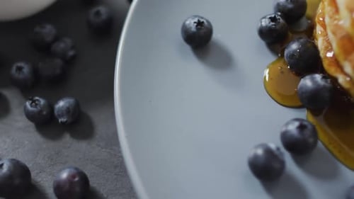 Pancakes Stacked with Blueberries and Syrup Close Up