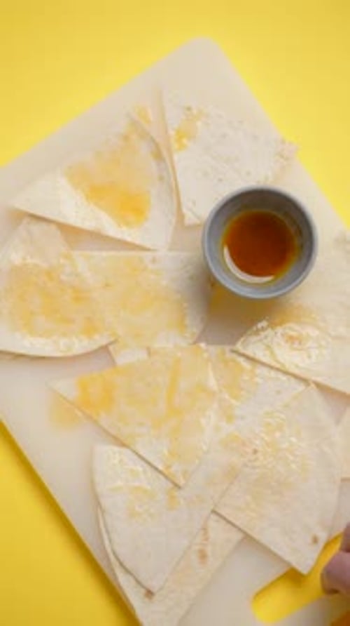 Vertical Flat Lay Video Chef Takes Off the Board with Nachos and Sauce