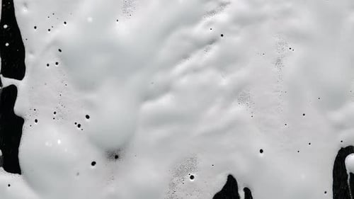 The Concept of Cleaning and Disinfecting Surfaces From Viruses. Soapy Detergent on Glass. Foam and