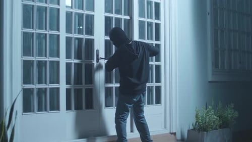 Masked Intruder Breaking into House at Night