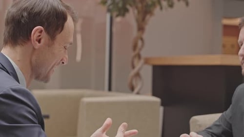 Businessmen Shaking Hands After Successful Meeting