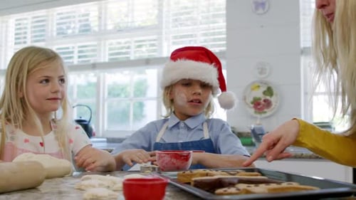 Family Baking Christmas Cookies in Bright Kitchen