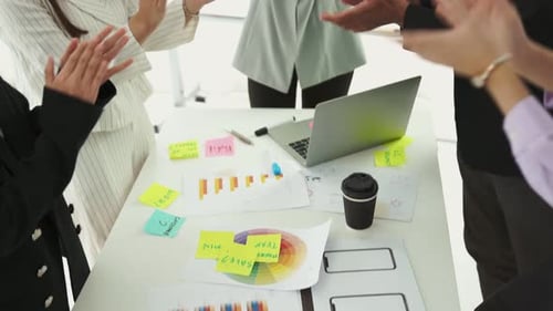 Colleagues Celebrate Business Success at Whiteboard