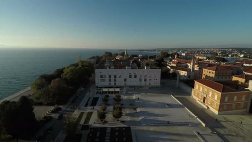 Aerial view of the sea and a square