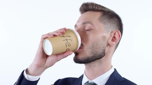 Young Adult Businessman Drinking Coffee