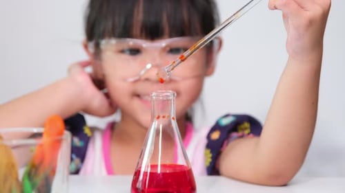 Enthusiastic Child Doing Science Experiment at Home