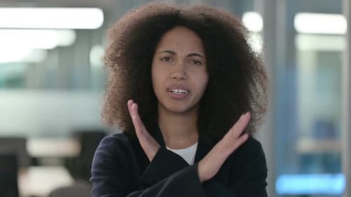 Portrait of African Businesswoman Showing No Sign By Arm Gesture